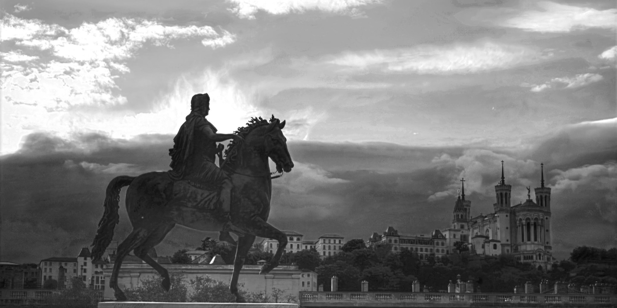 Louis XIV statue silhouette facing Fourvière, black and white
