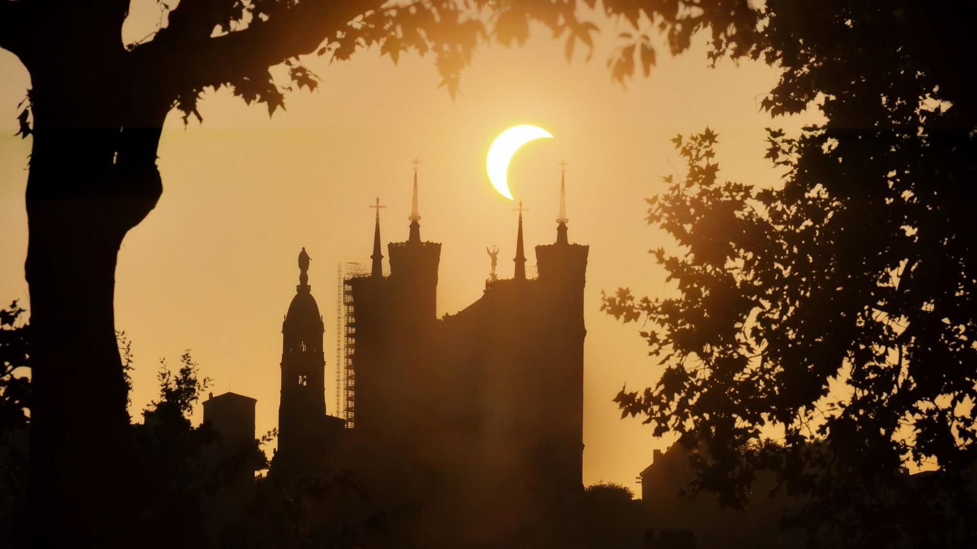 Basilique Notre-Dame de Fourvière in silhouette during the partial solar eclipse