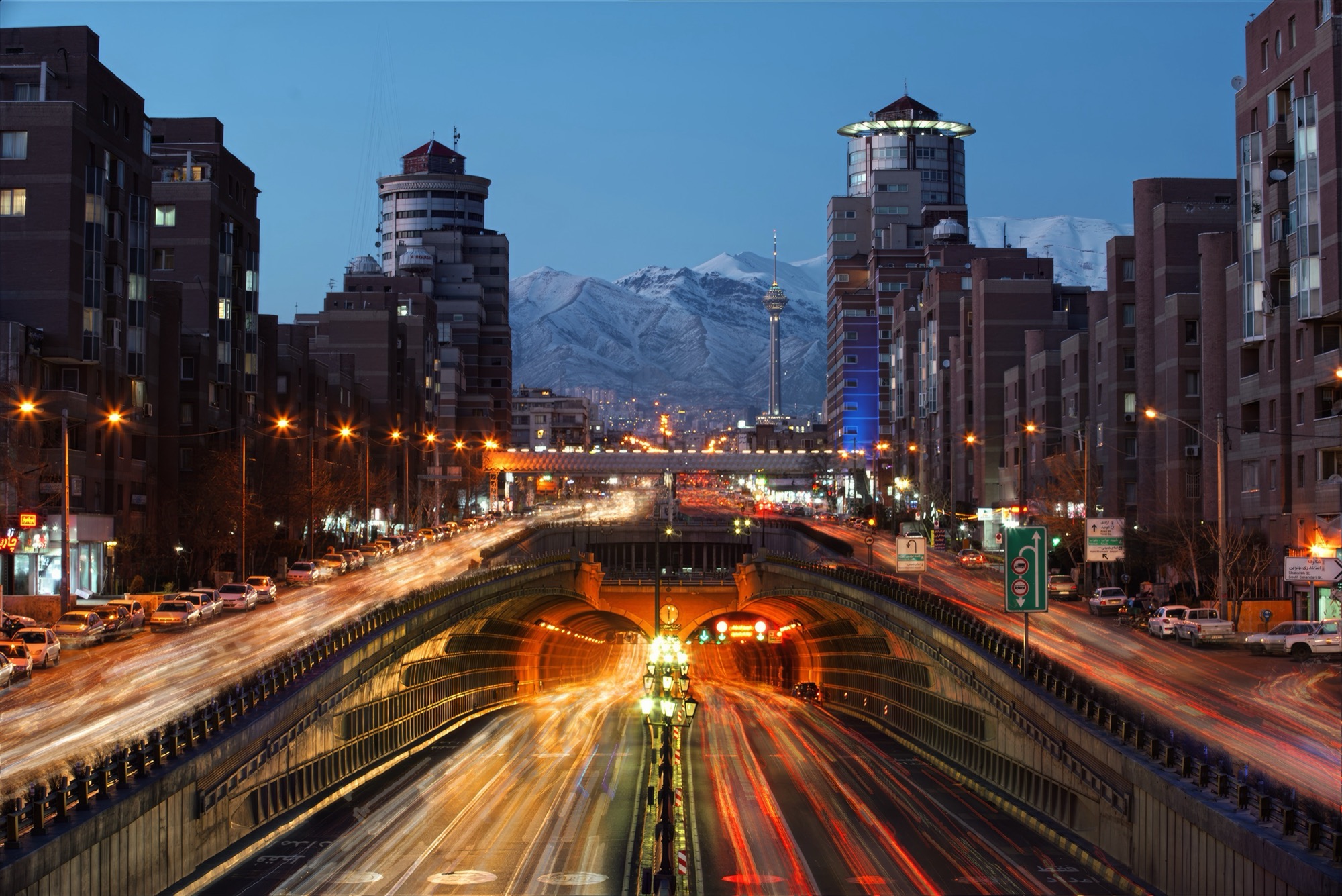 Tehran avenue at dusk, Milad Tower and Alborz